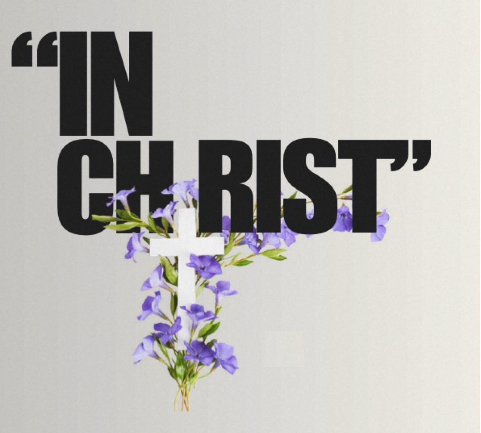 In Christ: bold editorial type with a white cross wrapped in periwinkle flowers